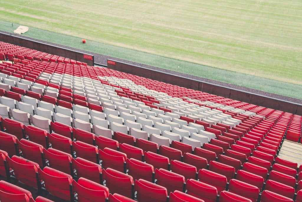 view of anfield stadium, red chairs