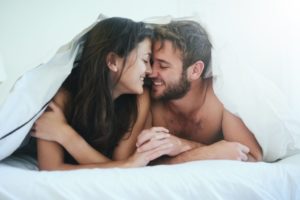 fresh breath clinches deal, shows a man and woman with naked shoulders in between white sheets