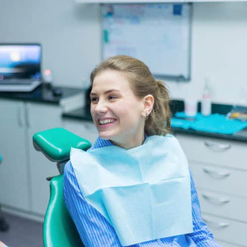 Extractions at Glastonbury shows woman looking confident in dental chair