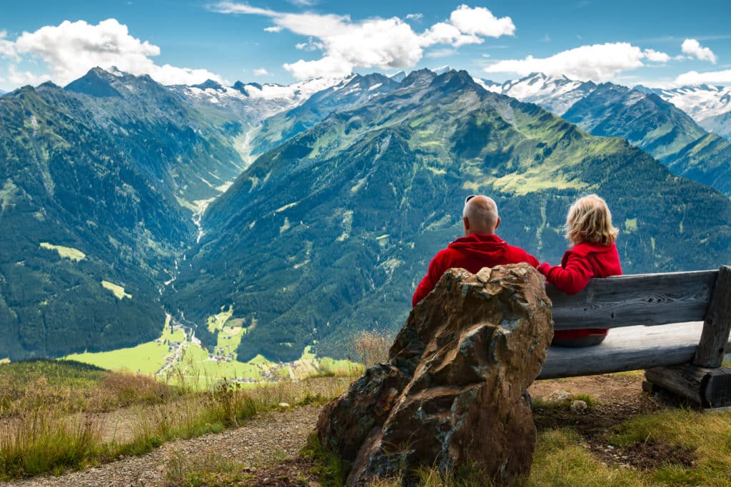 fullwidth preserve aging teeth shows a couple looking atmountains in the distance