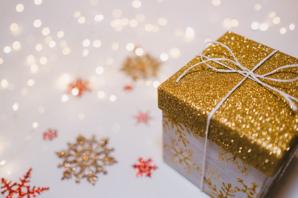 attractive gold box and festive sparkles to wrap top ten dental gifts