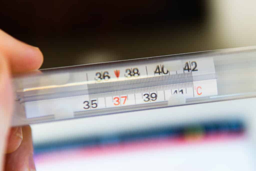 thermometer showing temperature for Covid-19 self-test