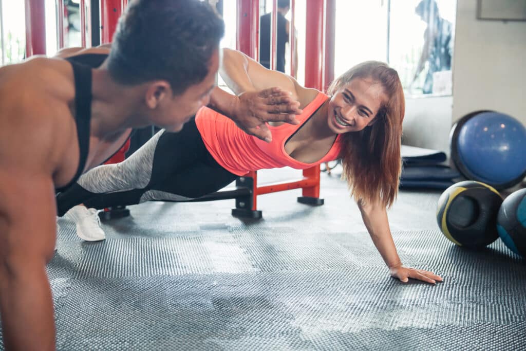 couple in fitness gym good for oral health