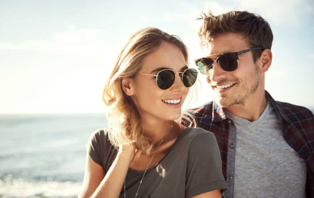 sunny smile vitamin D couple wearing sunglasses