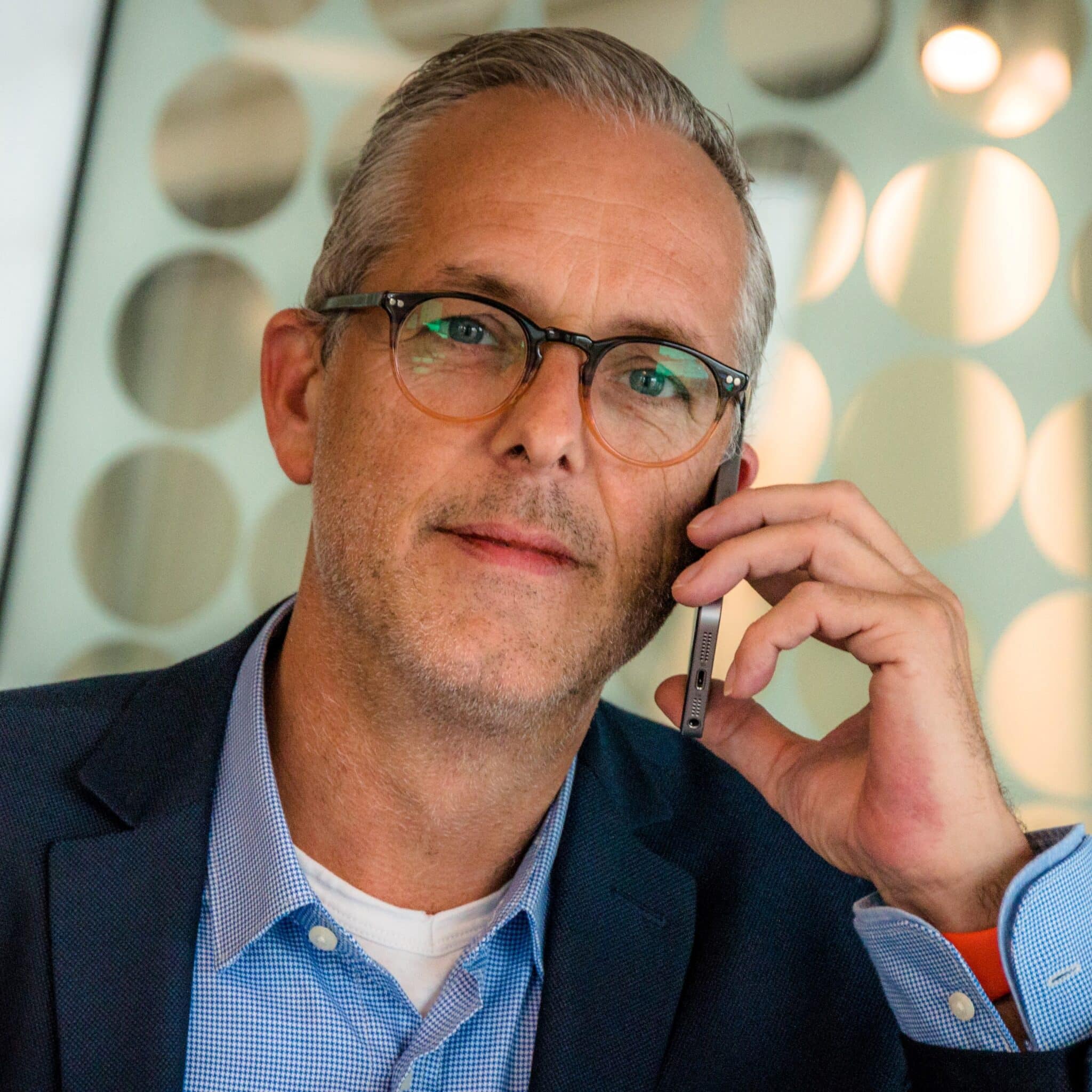 man on phone cancellation policy call.