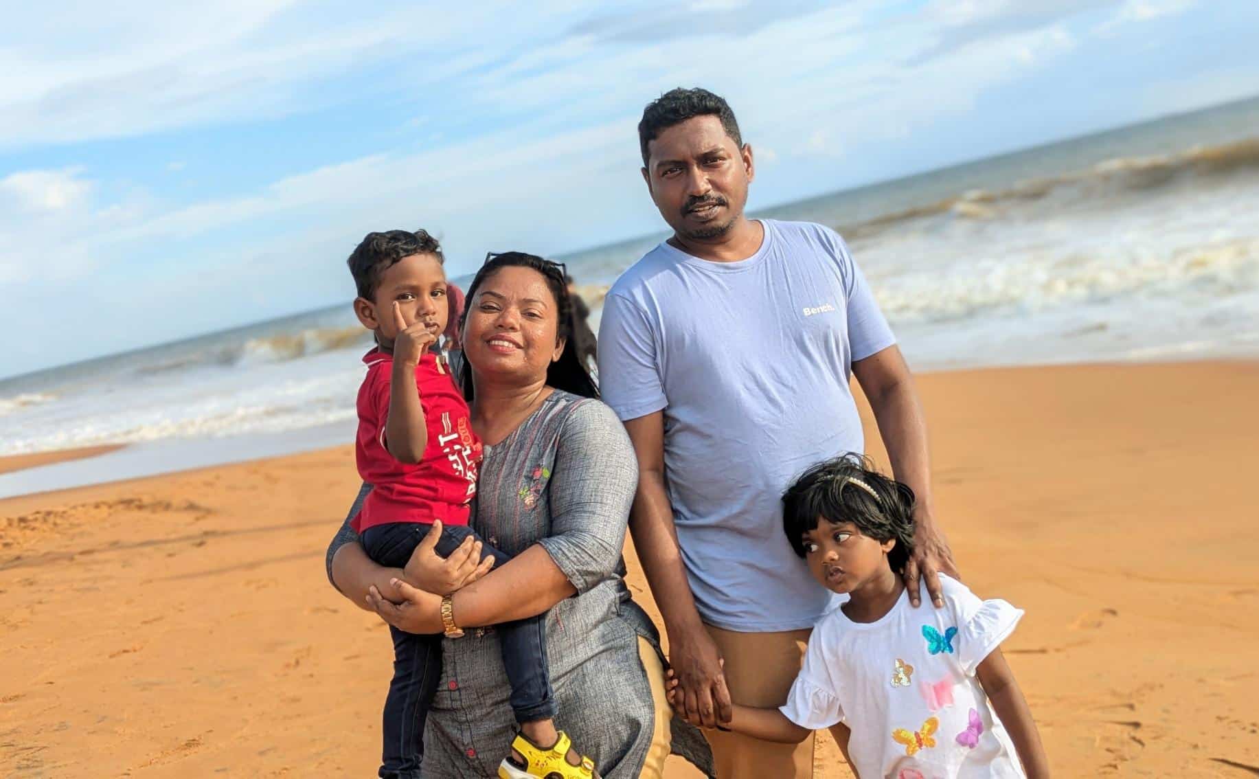 Family on a beach in Southwest India